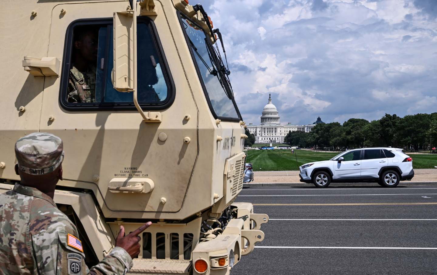 Military personnel chat on the National Mall in Washington, DC, on August 14, 2025.