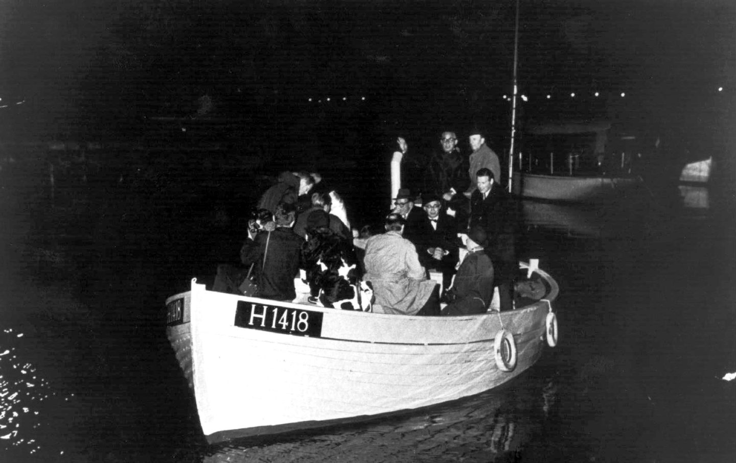 This 1943 photo shows a boat carrying people during the escape across the Oresound of some of 7,000 Danish Jews who fled to safety in neighboring Sweden as Denmark three years after the German Nazi invasion.