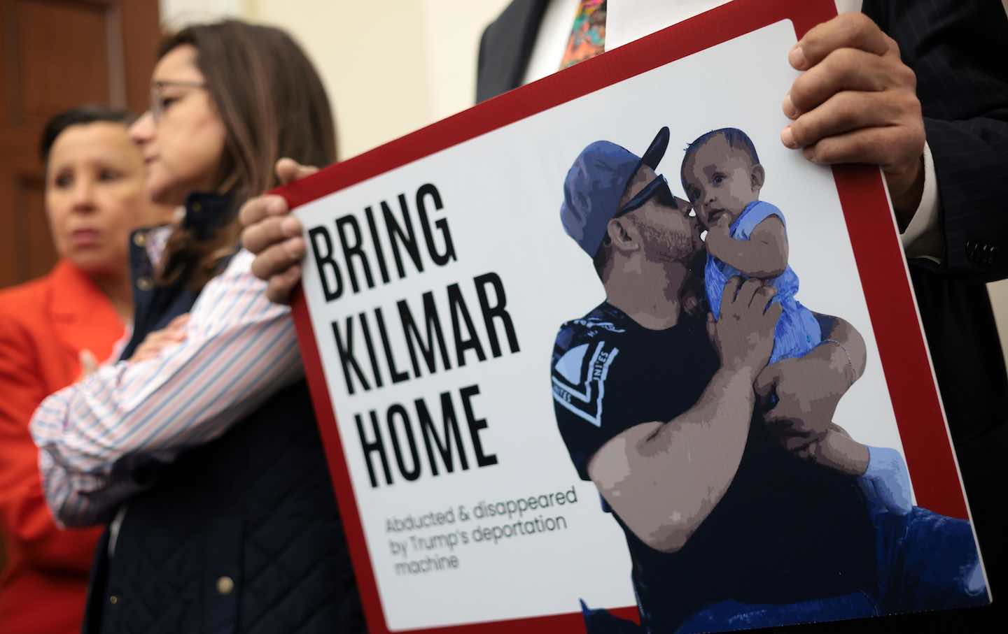 A member of the Congressional Hispanic Caucus holds a picture of Kilmar Abrego Garcia during a news conference to discuss Abrego Garcia's arrest and deportation d at Cannon House Office Building on April 9, 2025,
