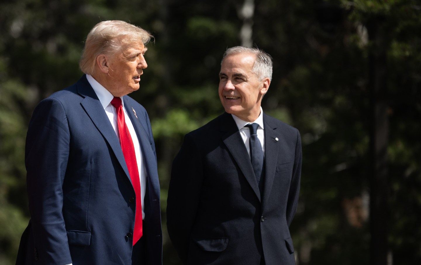 Canadian Prime Minister Mark Carney welcomes United States President Donald Trump during an arrival ceremony at the Group of Seven (G7) Summit at the Pomeroy Kananaskis Mountain Lodge in Kananaskis, Alberta, Canada on June 16, 2025.