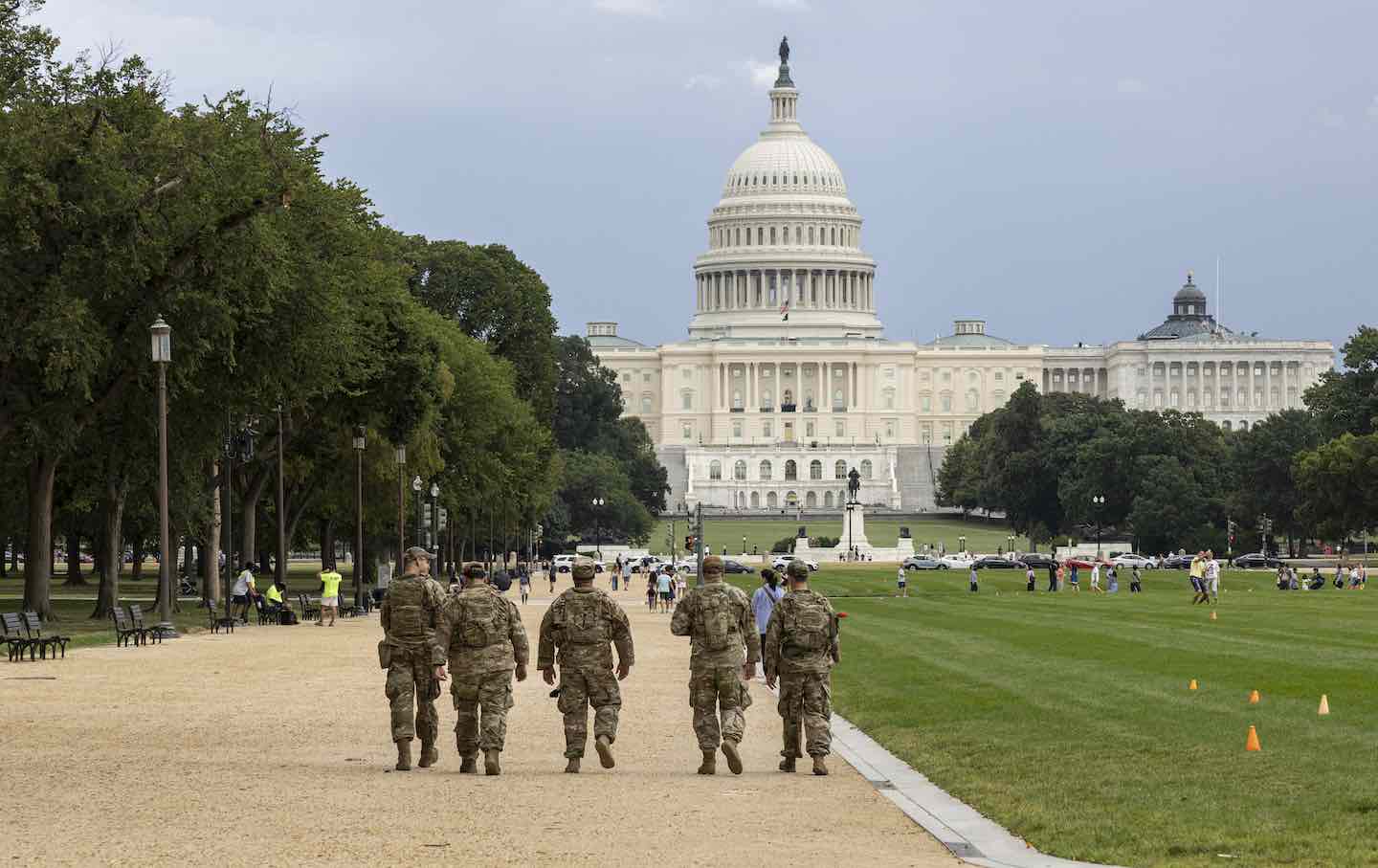 Members of the National Guard walk on the National Mall on August 14, 2025, in Washington, DC, following President Donald Trump’s deployment of federal forces and takeover of the city’s police department.