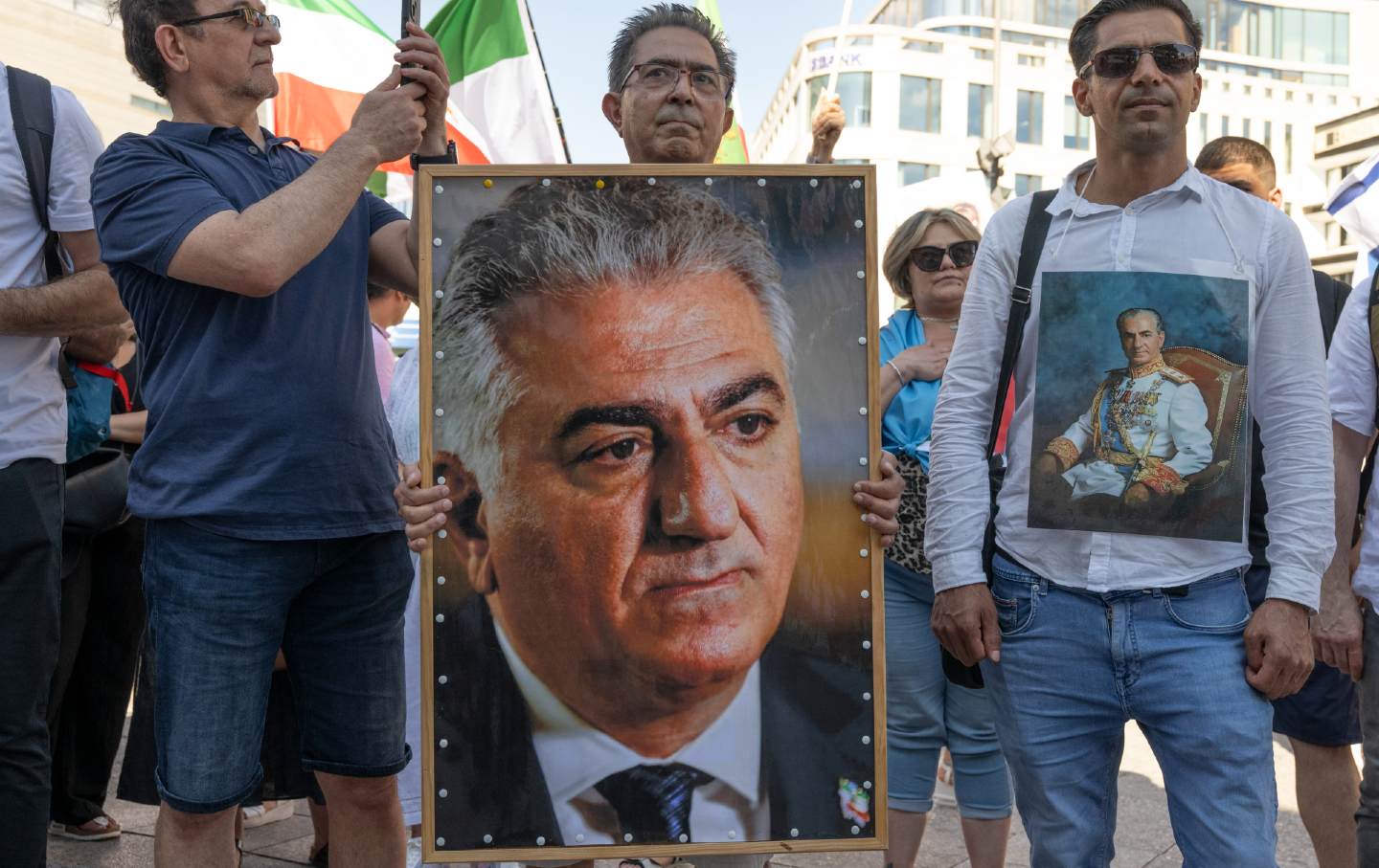 Mainly exiles and German-Iranians protest against the Mullah regime in Iran at a rally in Frankfurt, Germany. One man holds a photo of Reza Pahlavi II, who is living in exile.